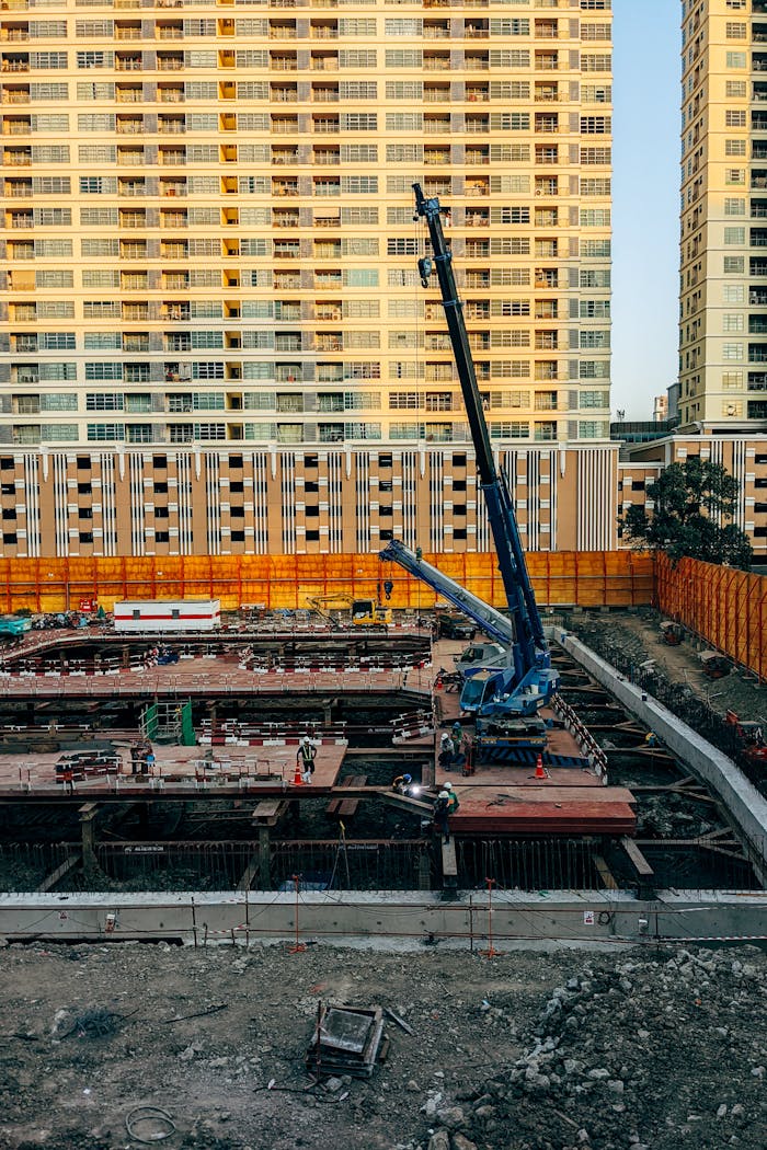 services-02 A vibrant city construction site with towering high-rises in the background.